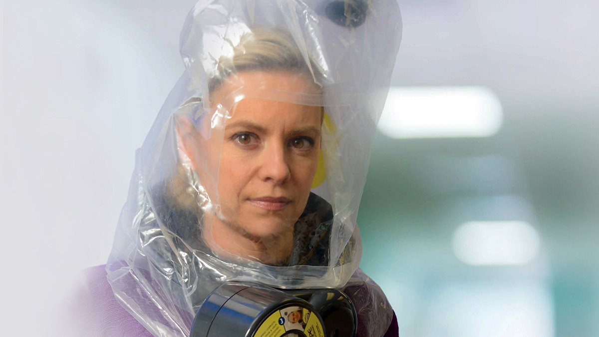 Woman wears ILC Dover's SCape® CO/CBRN30 escape respirator system