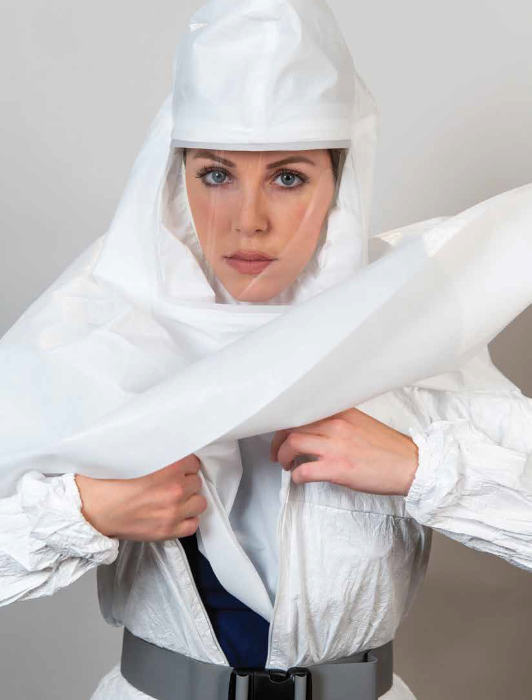 Woman shows off flexible design of ILC Dover's BioShield Full Hood in infectious disease setting