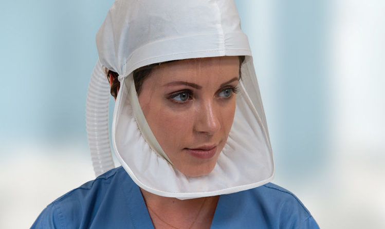 Healthcare professional wears ILC Dover's Sentinel XL®️ HP powered air purifying respirator (PAPR) head cover