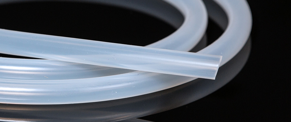 A roll of silicone tubing from ILC Dover on a black background
